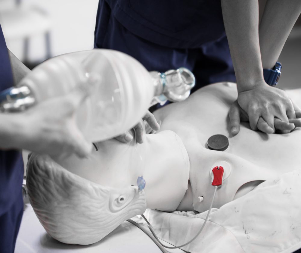 CPR Nurses performing CPR on a test dummy for a demonstration.